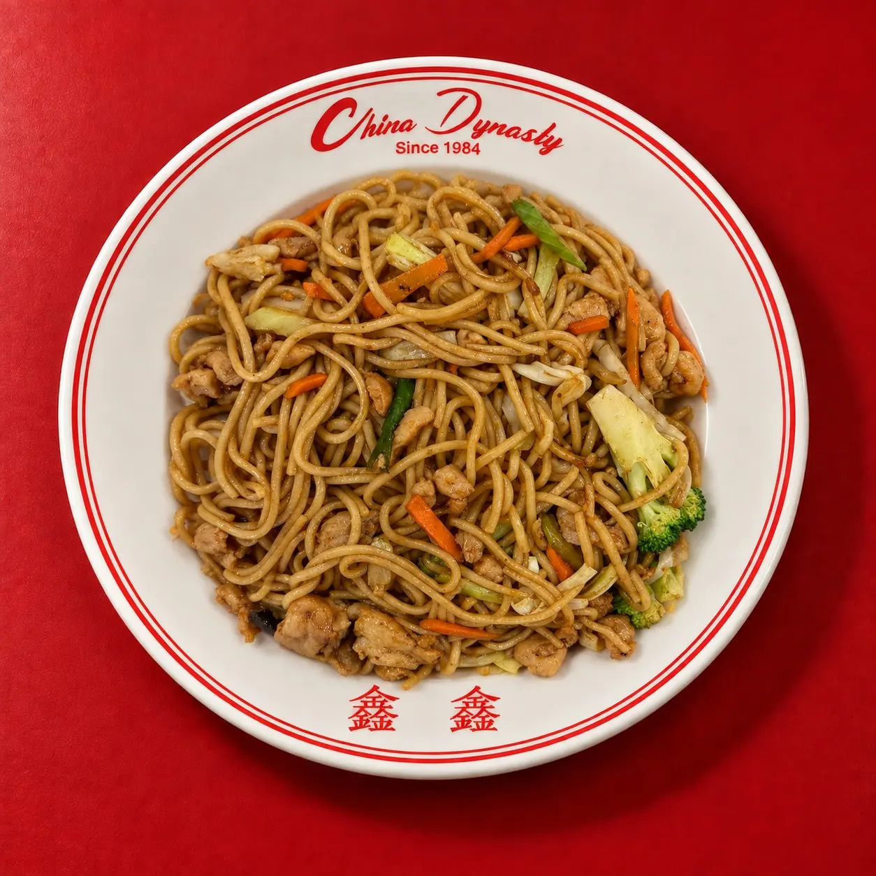 Chicken lo mein with broccoli, cabbage and carrots, soft noodles tossed in soy sauce