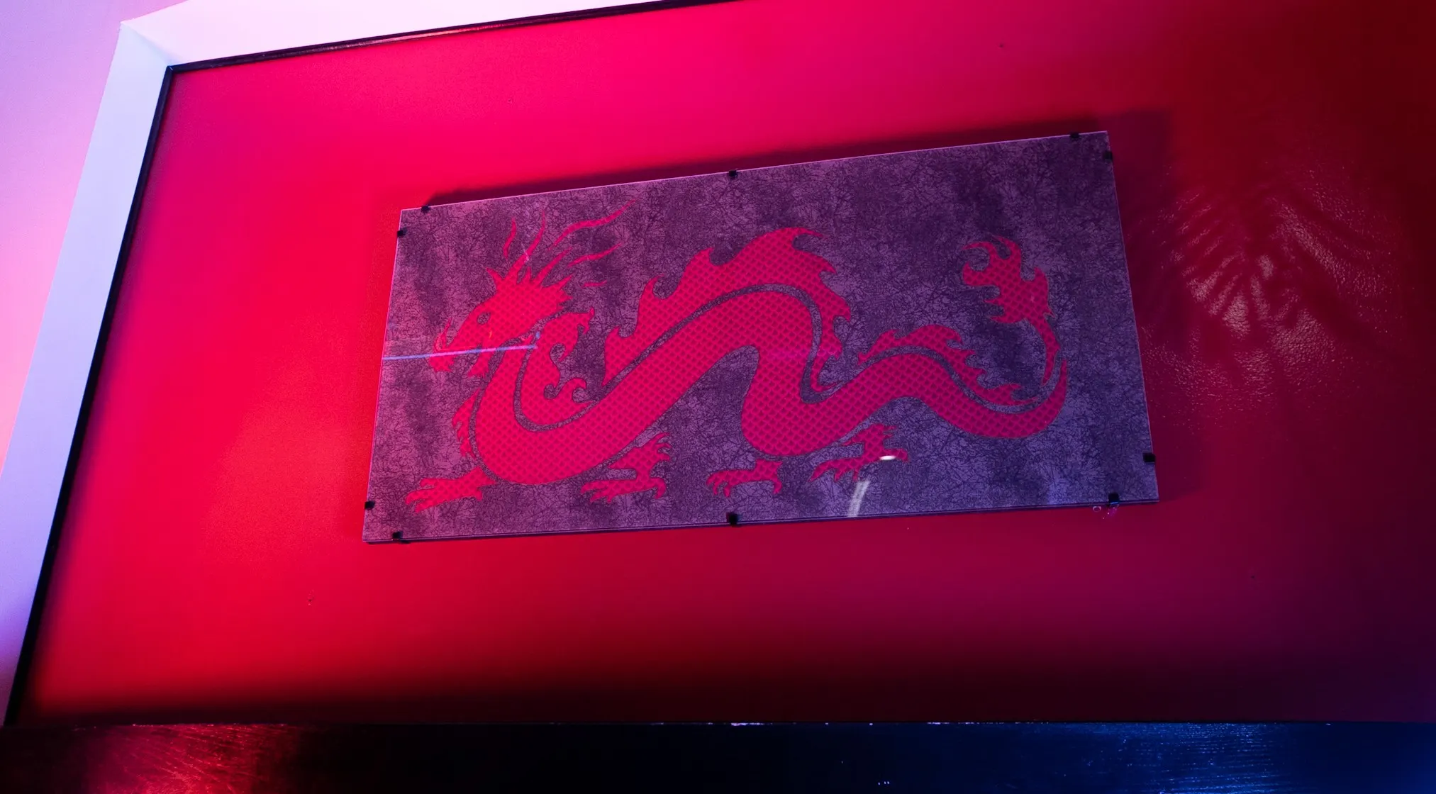 Red dragon artwork on the wall inside China Dynasty