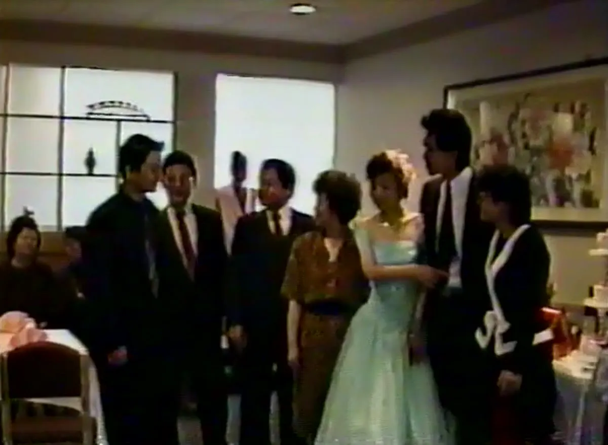 Both families lined up with Judy and Jim in the dining room at their engagement party, 1989