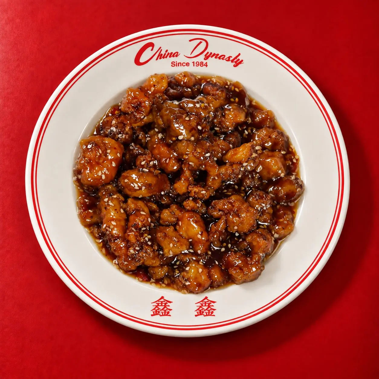 Sesame chicken, China Dynasty’s #1 bestseller: crispy chicken glazed in Grandma’s sweet and spicy sesame sauce