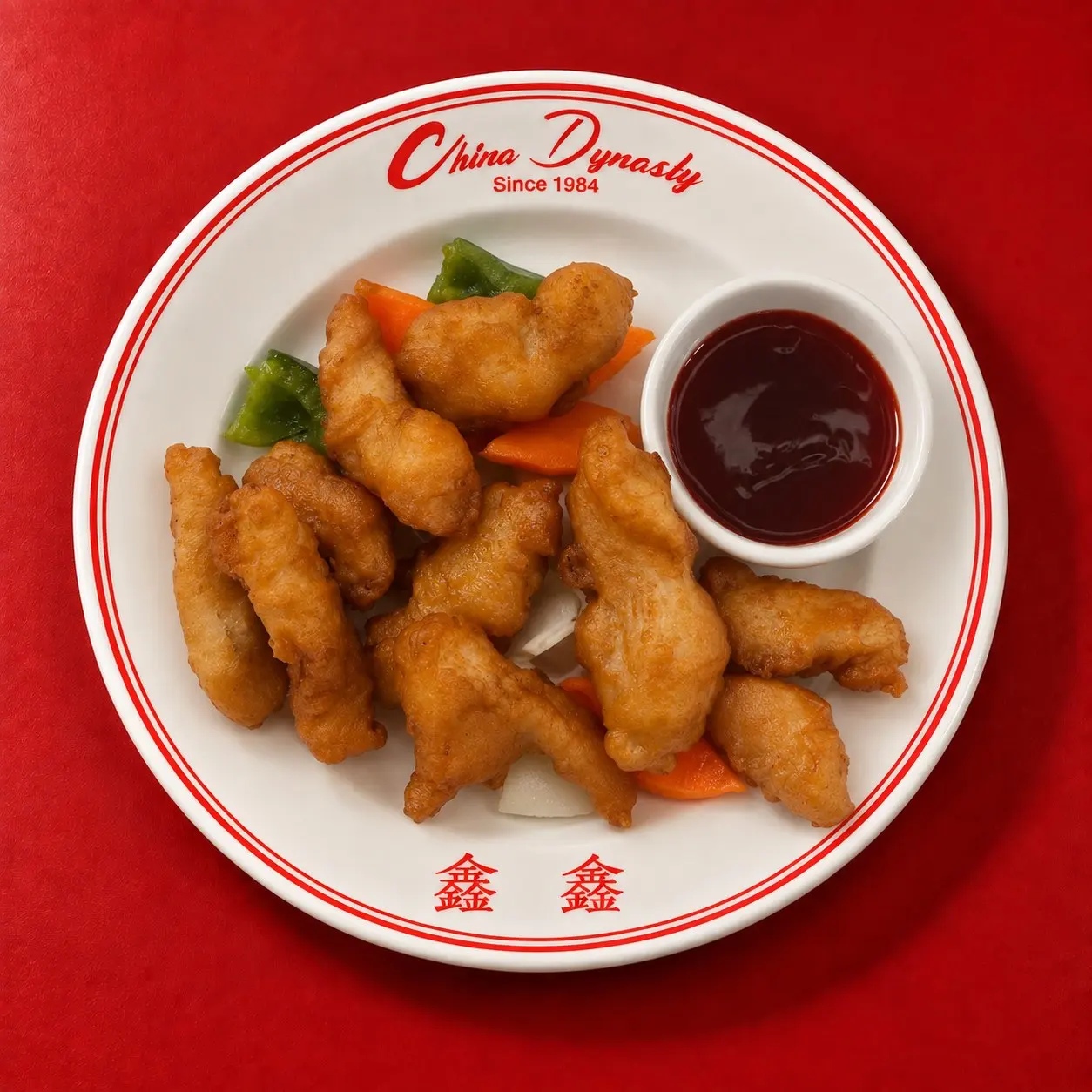 Sweet and sour chicken, crispy white-meat chicken with homemade sweet and sour sauce on the side